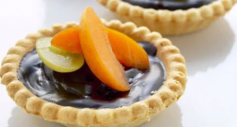 recipe image Tarteletes de chocolate com alperces frescos